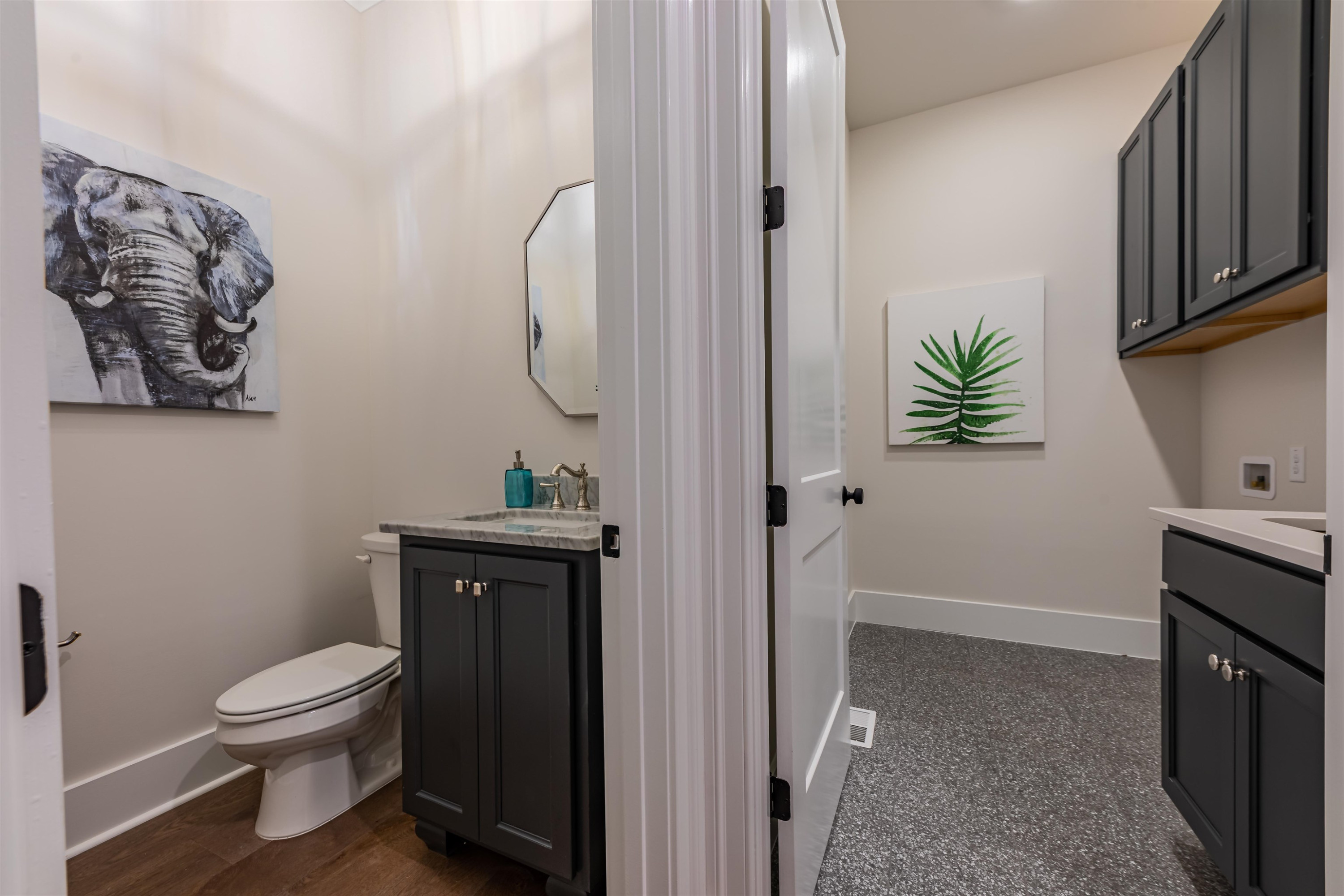 1220 Dixie Trail Raleigh, NC 27607 - Photo 18 of 40 a bathroom with a toilet a sink and mirror