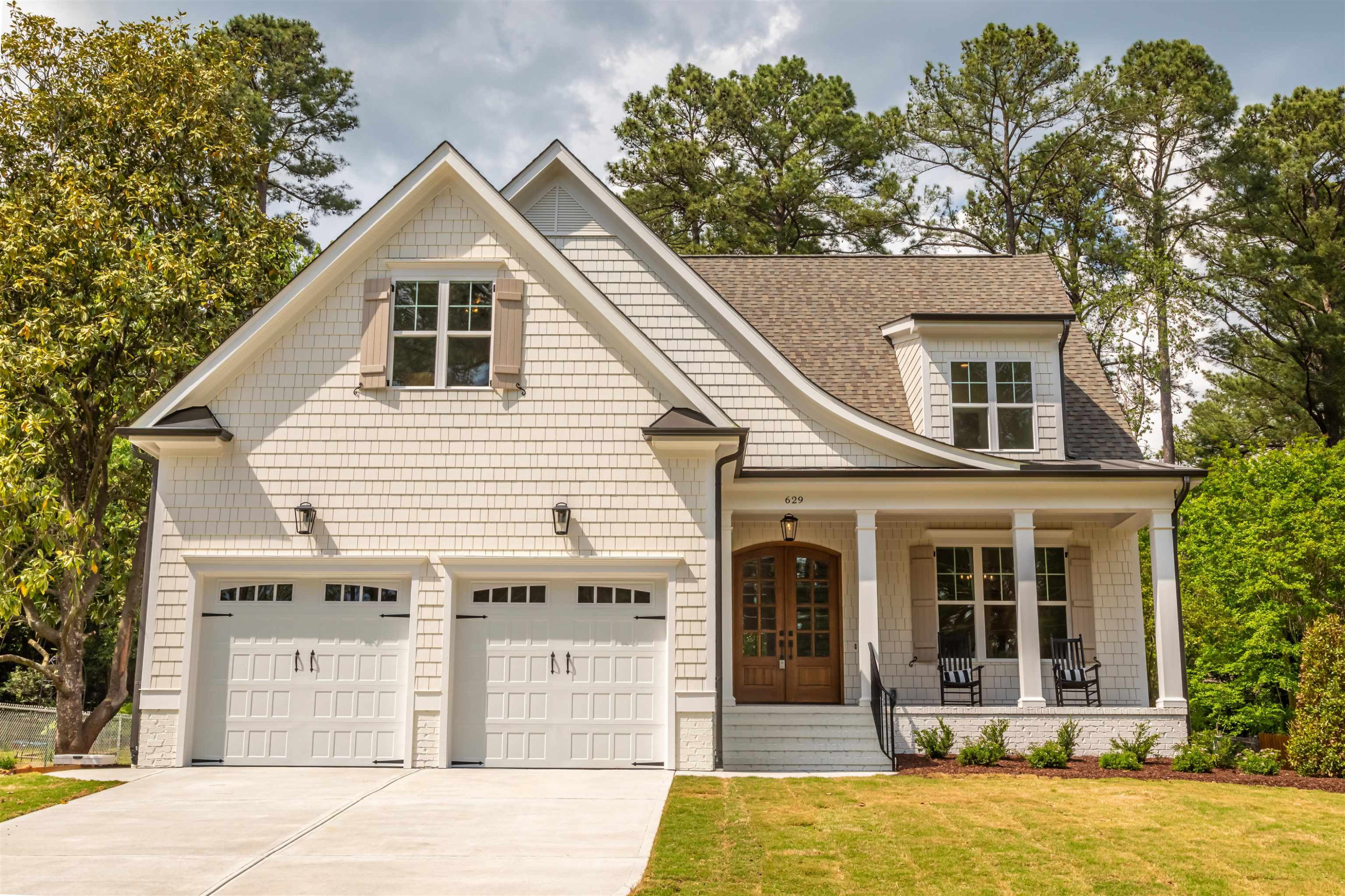 1220 Dixie Trail Raleigh, NC 27607 - Photo 2 of 40 a front view of a house with a yard