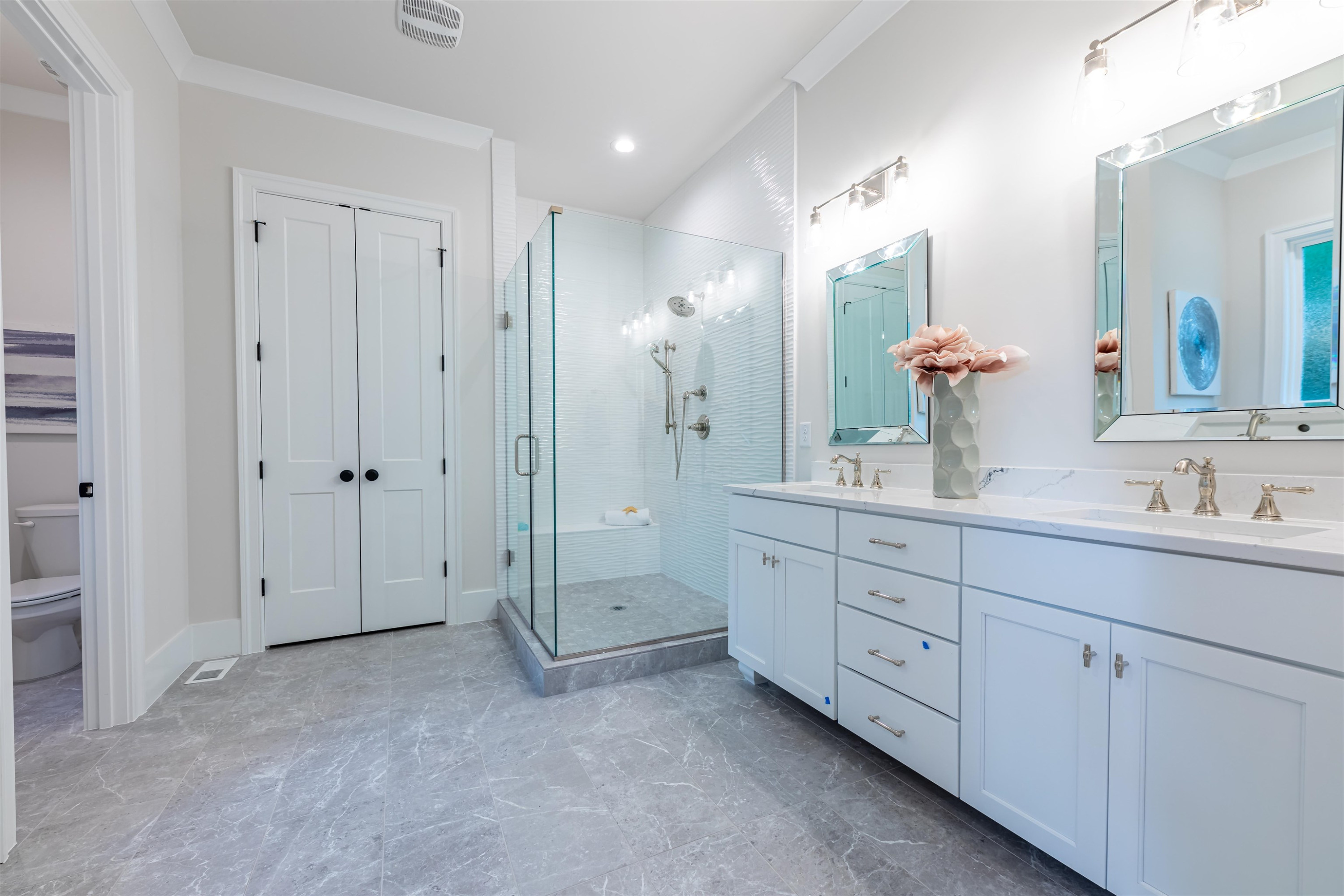 1220 Dixie Trail Raleigh, NC 27607 - Photo 21 of 40 a spacious bathroom with double sink and a mirror