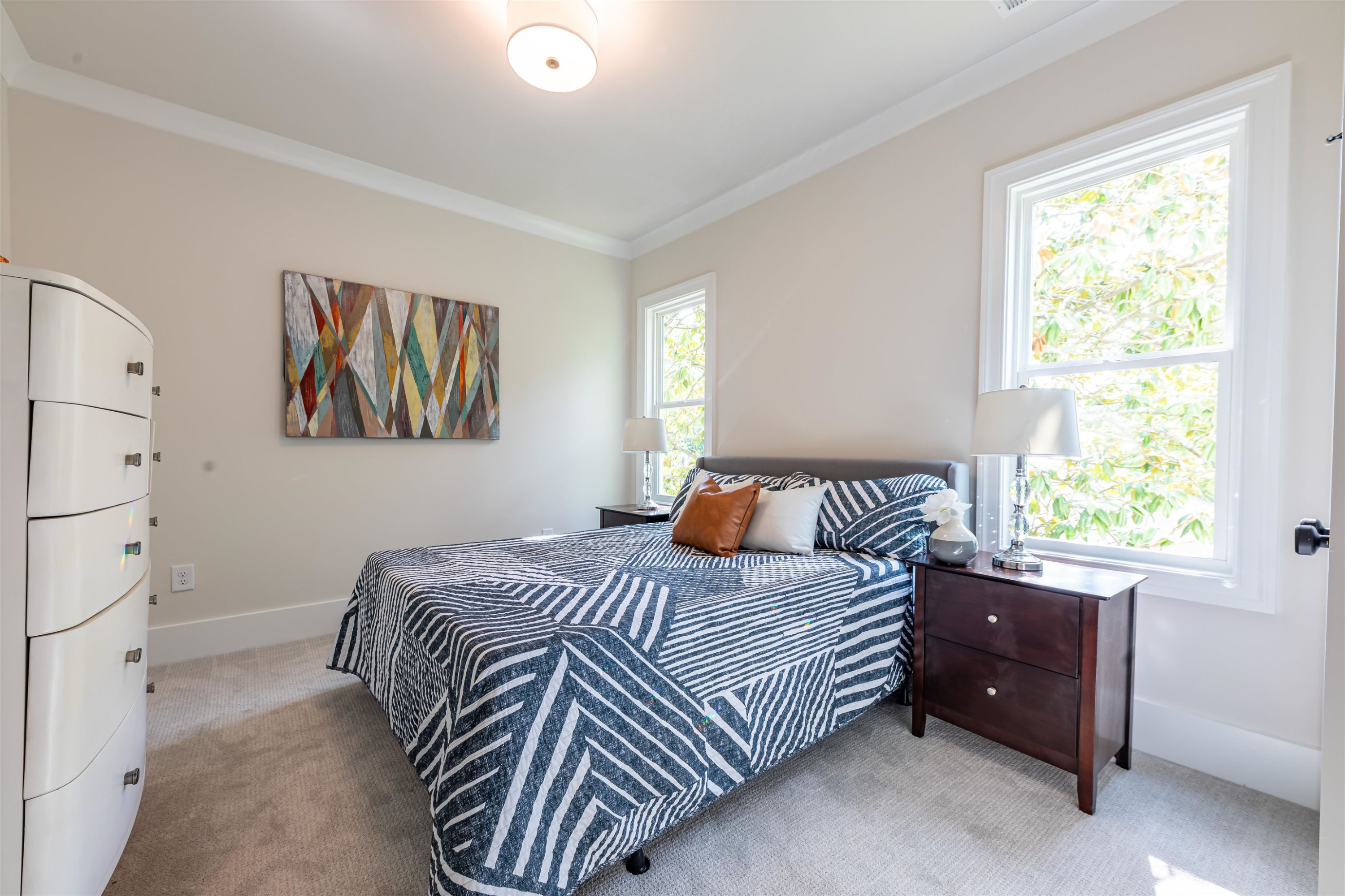 1220 Dixie Trail Raleigh, NC 27607 - Photo 29 of 40 a bedroom with a bed and a window