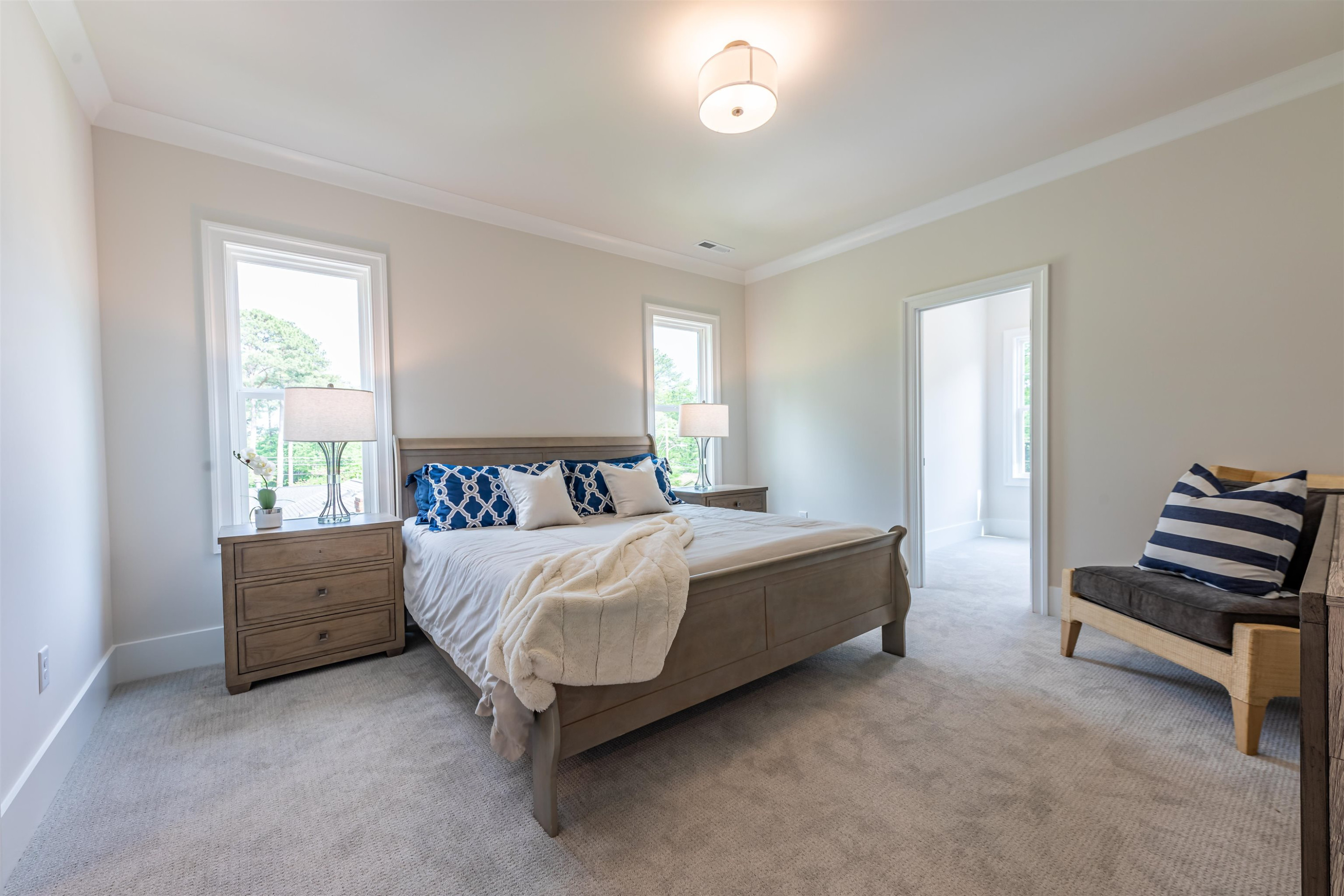 1220 Dixie Trail Raleigh, NC 27607 - Photo 32 of 40 a bed room with a bed and a chair