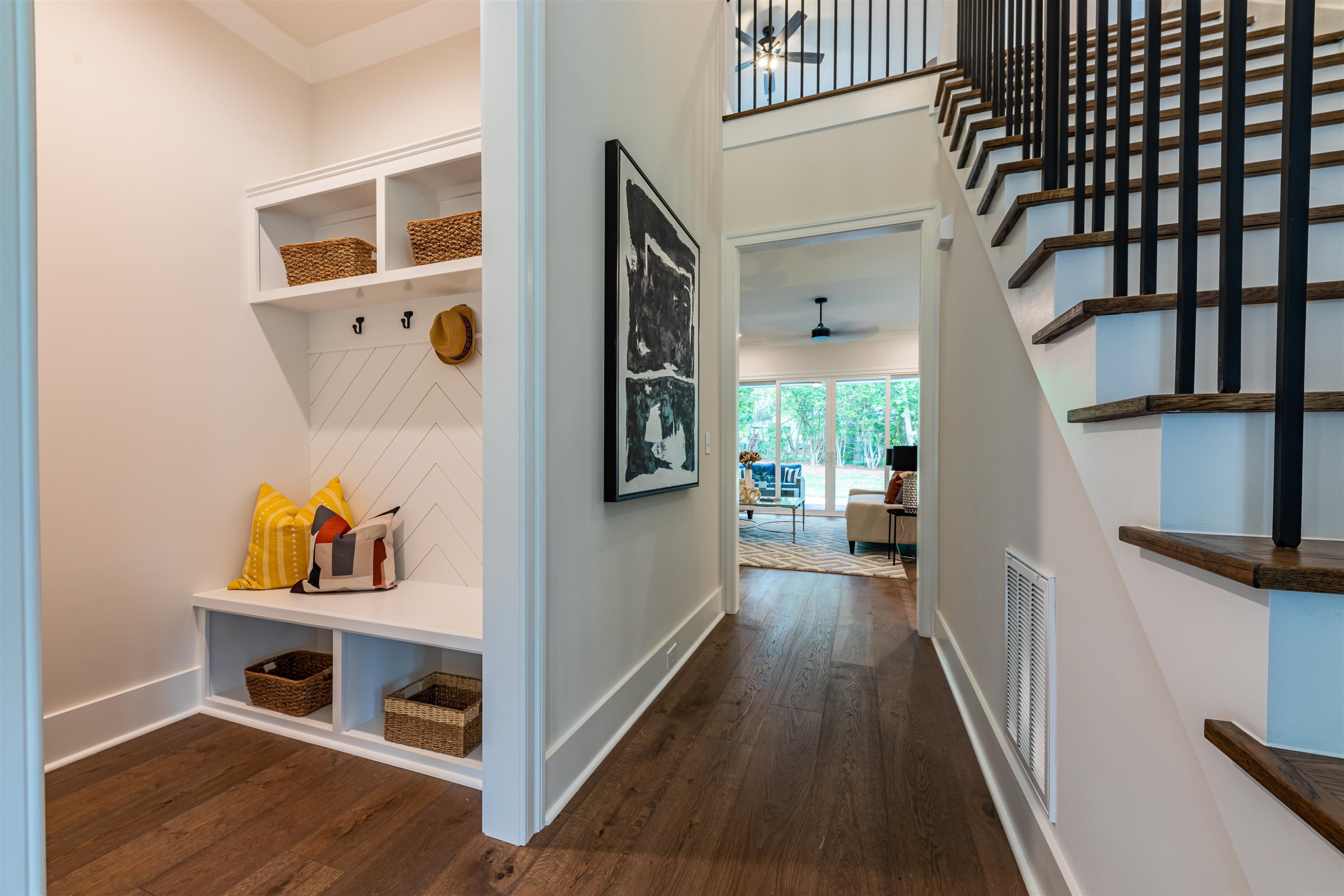 1220 Dixie Trail Raleigh, NC 27607 - Photo 5 of 40 a view of a hallway to of a house with wooden floor and furniture