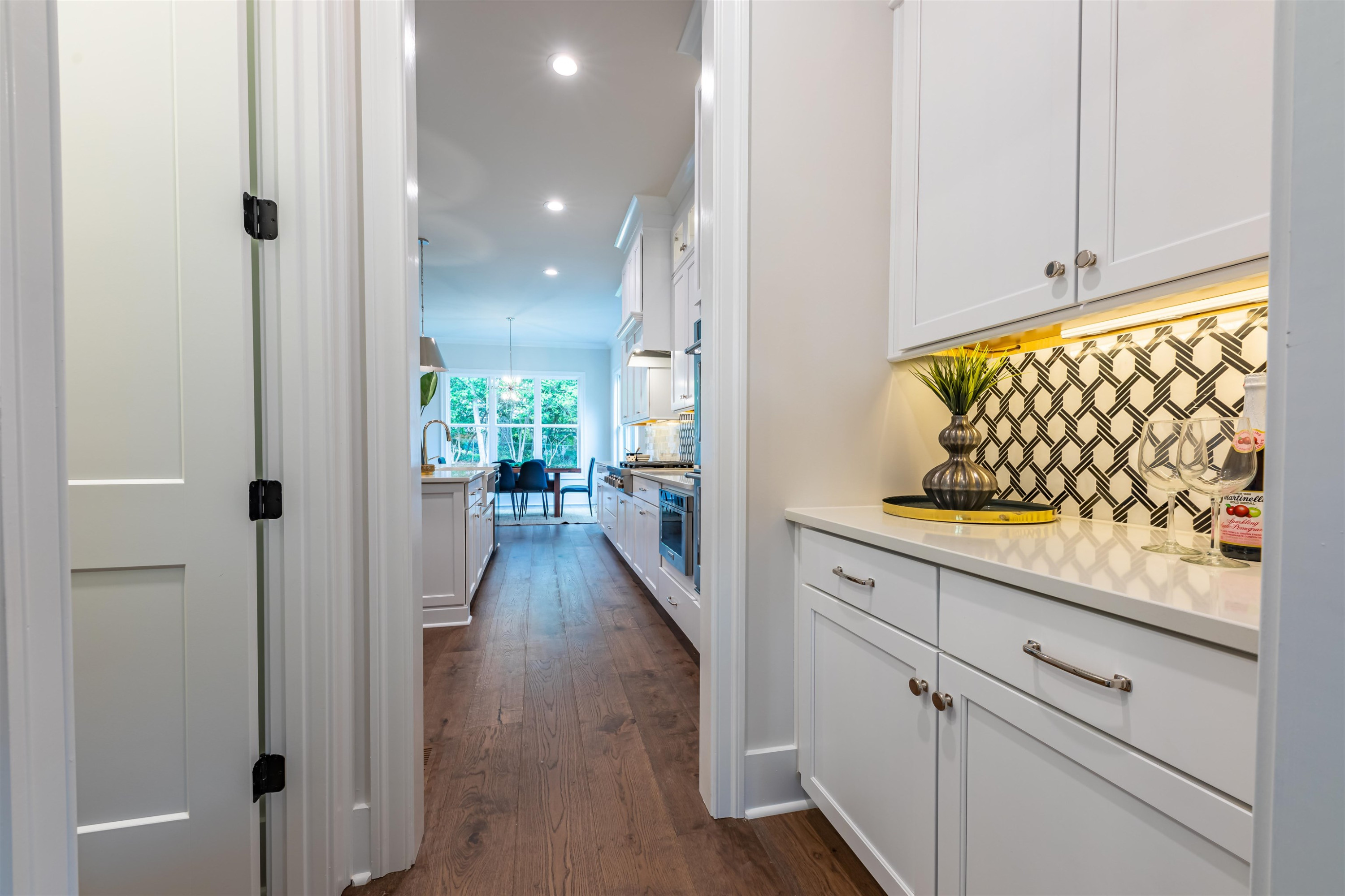 1220 Dixie Trail Raleigh, NC 27607 - Photo 8 of 40 a view of a hallway with wooden floor and staircase