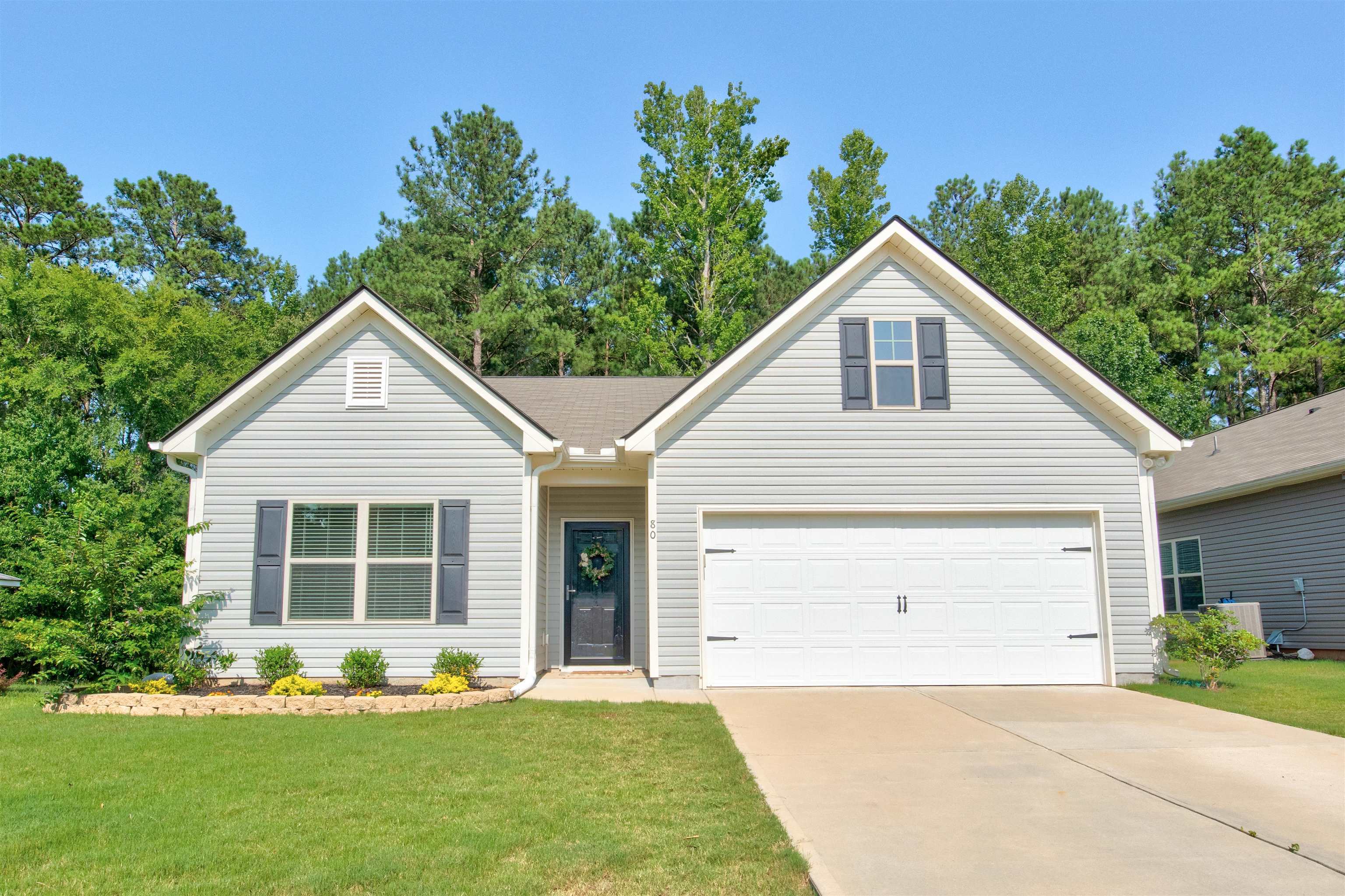 80 Willowrun Drive Rome, GA 30165 - Photo 1 of 1 a front view of a house with a yard and garage