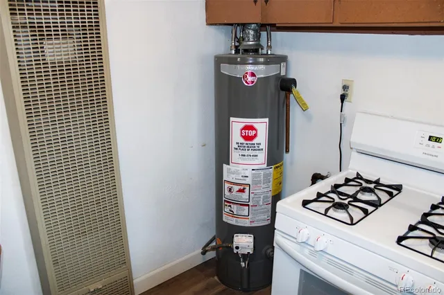a close view of a sink a stove and a refrigerator