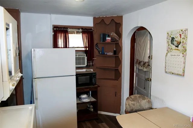 a white refrigerator freezer sitting in a kitchen
