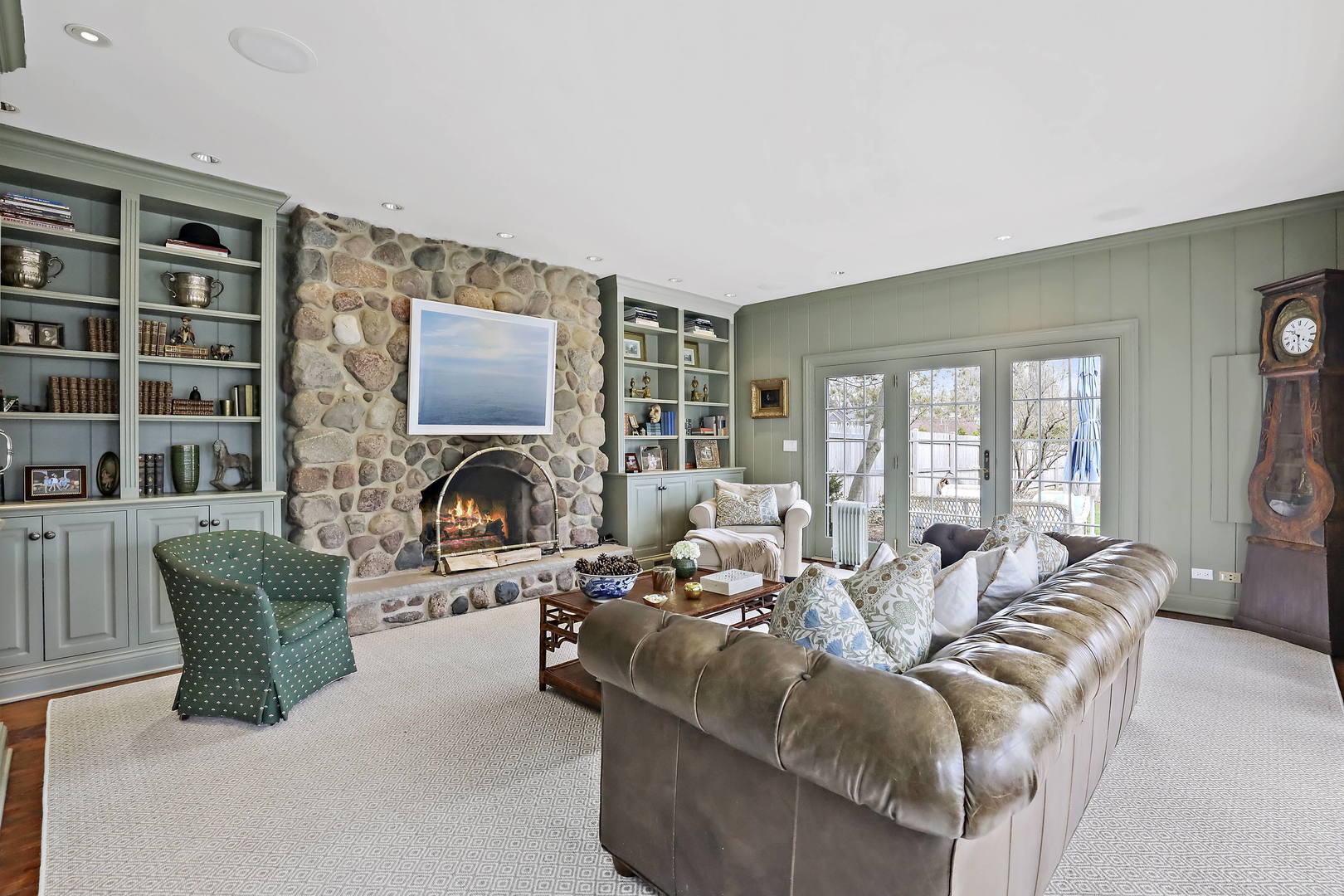 138 East Sheridan Road Lake Bluff, IL 60044 - Photo 15 of 39 a living room with fireplace furniture and a large window