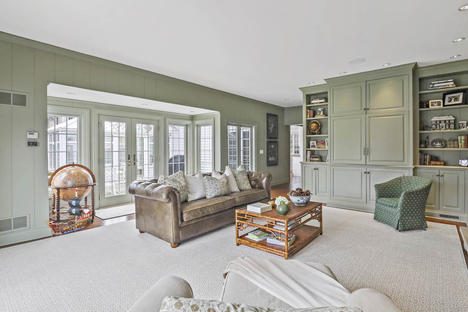 138 East Sheridan Road Lake Bluff, IL 60044 - Photo 16 of 39 a living room with furniture and a large window