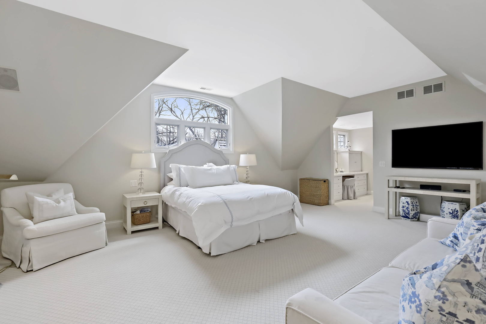 138 East Sheridan Road Lake Bluff, IL 60044 - Photo 22 of 39 a bedroom with a bed and a flat screen tv