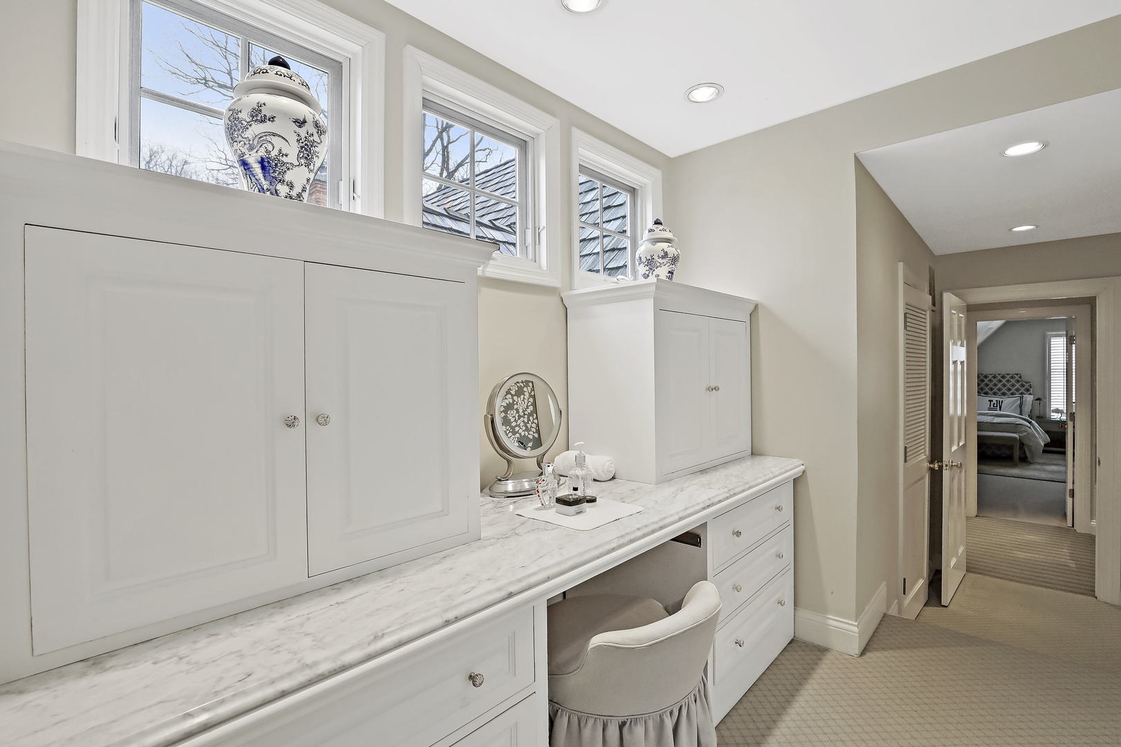 138 East Sheridan Road Lake Bluff, IL 60044 - Photo 23 of 39 a bathroom with a sink a mirror and a shower