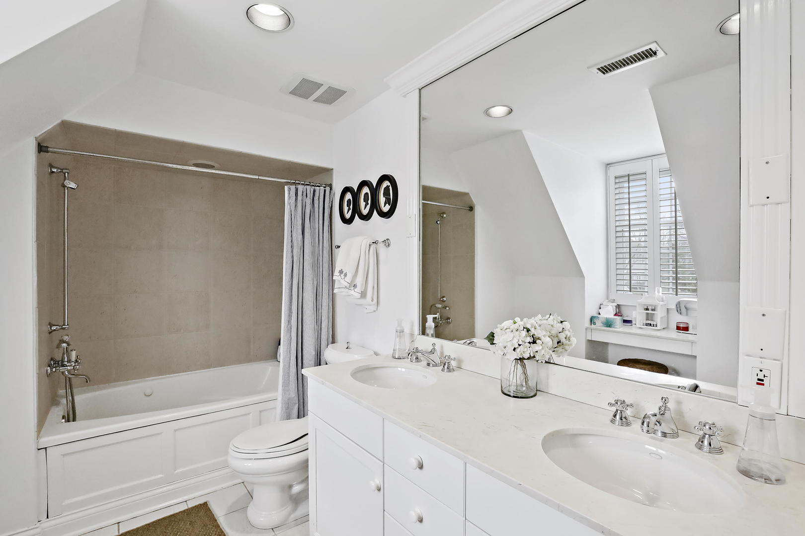 138 East Sheridan Road Lake Bluff, IL 60044 - Photo 30 of 39 a bathroom with a double vanity sink toilet mirror and shower