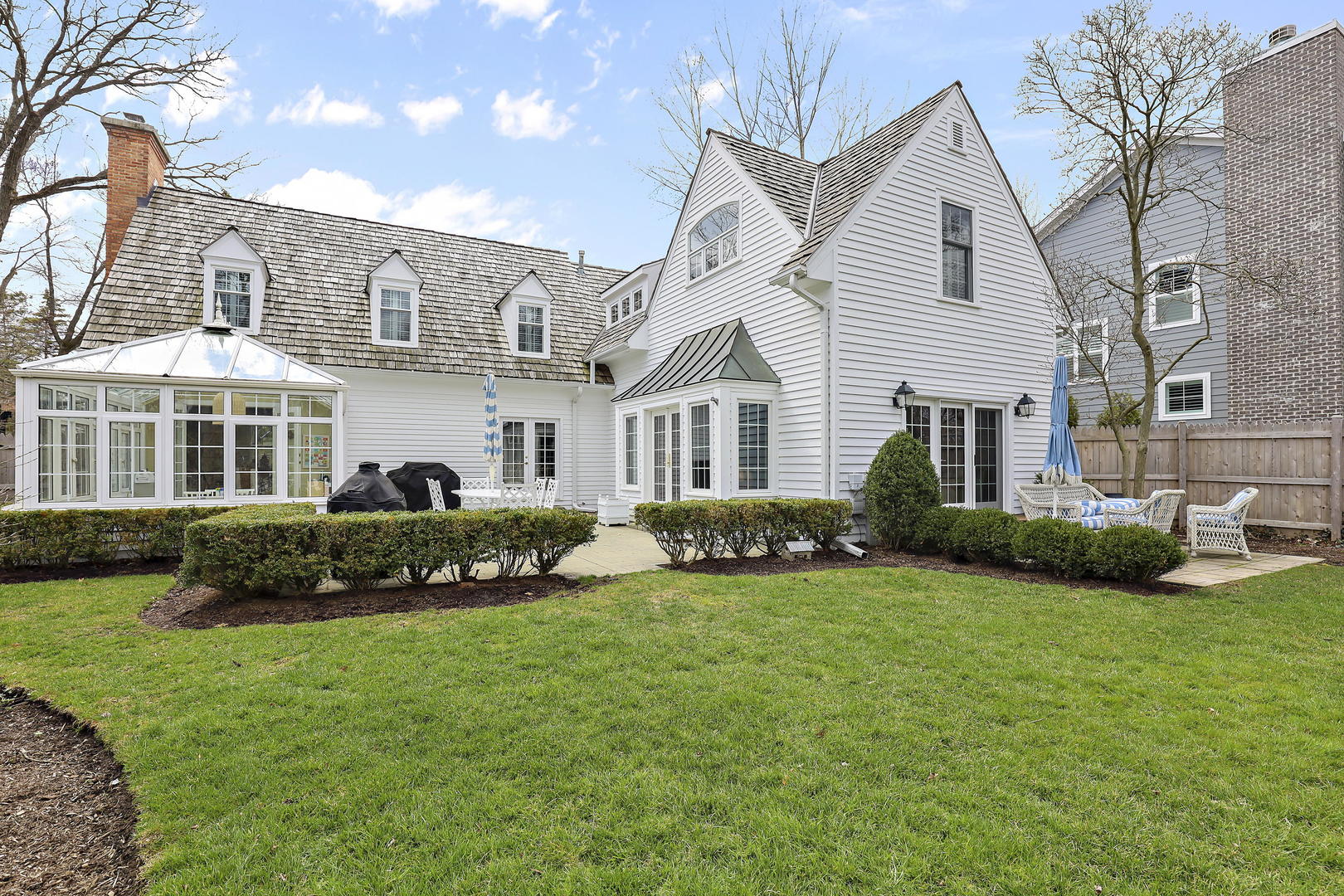 138 East Sheridan Road Lake Bluff, IL 60044 - Photo 35 of 39 a front view of a house with a garden