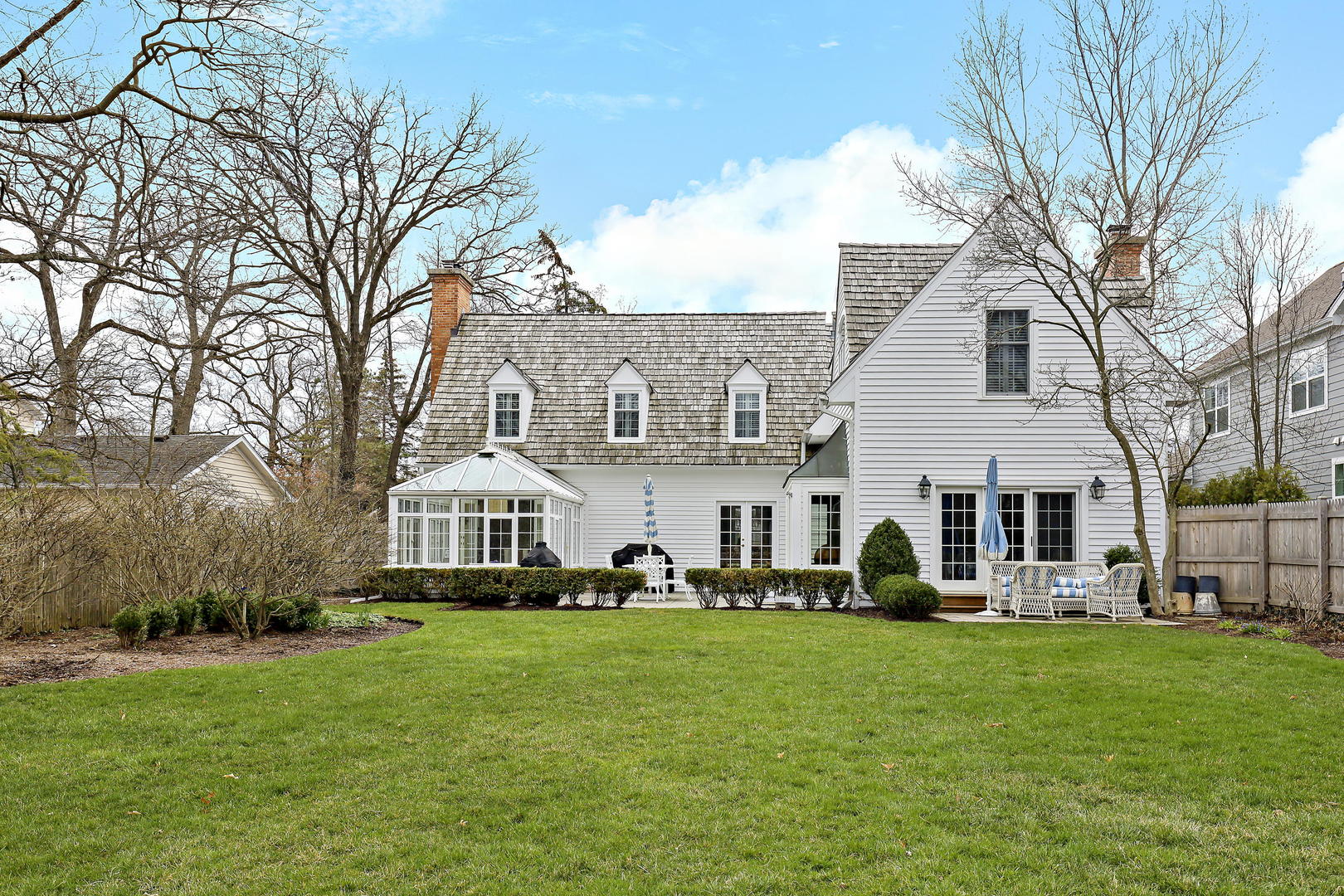 138 East Sheridan Road Lake Bluff, IL 60044 - Photo 36 of 39 a front view of a house with a garden and trees