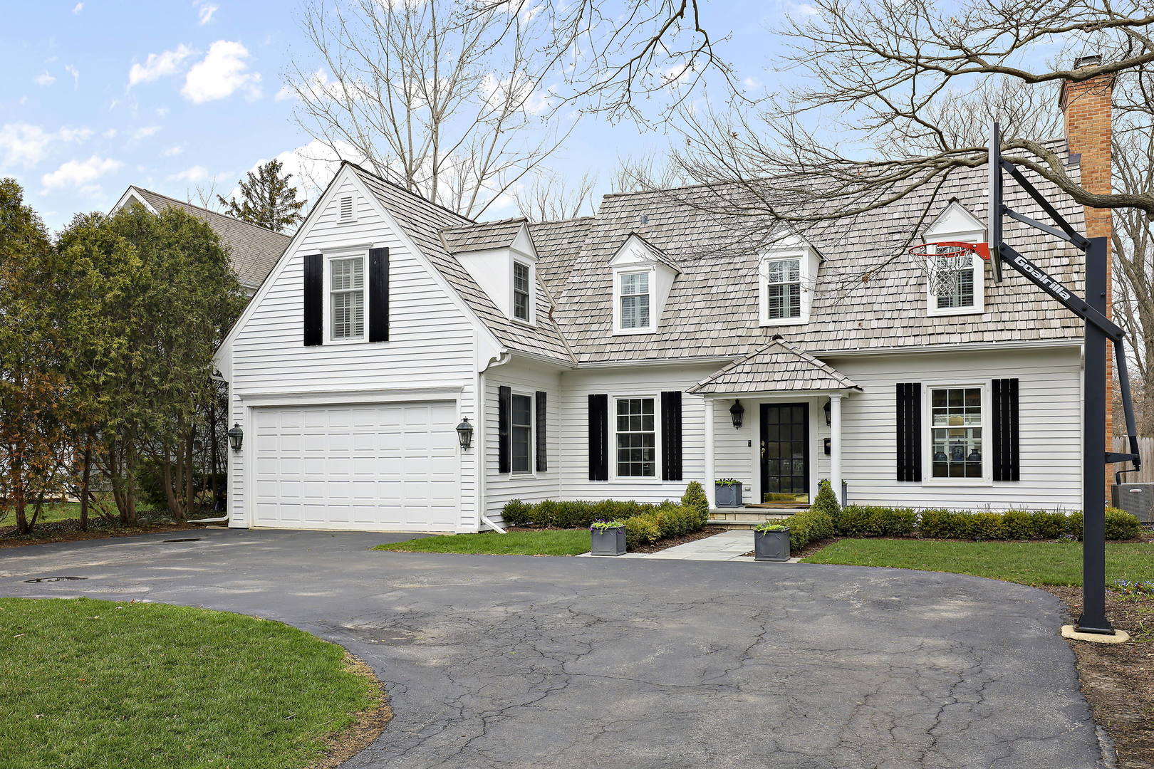 138 East Sheridan Road Lake Bluff, IL 60044 - Photo 38 of 39 a front view of a house with a garden and trees