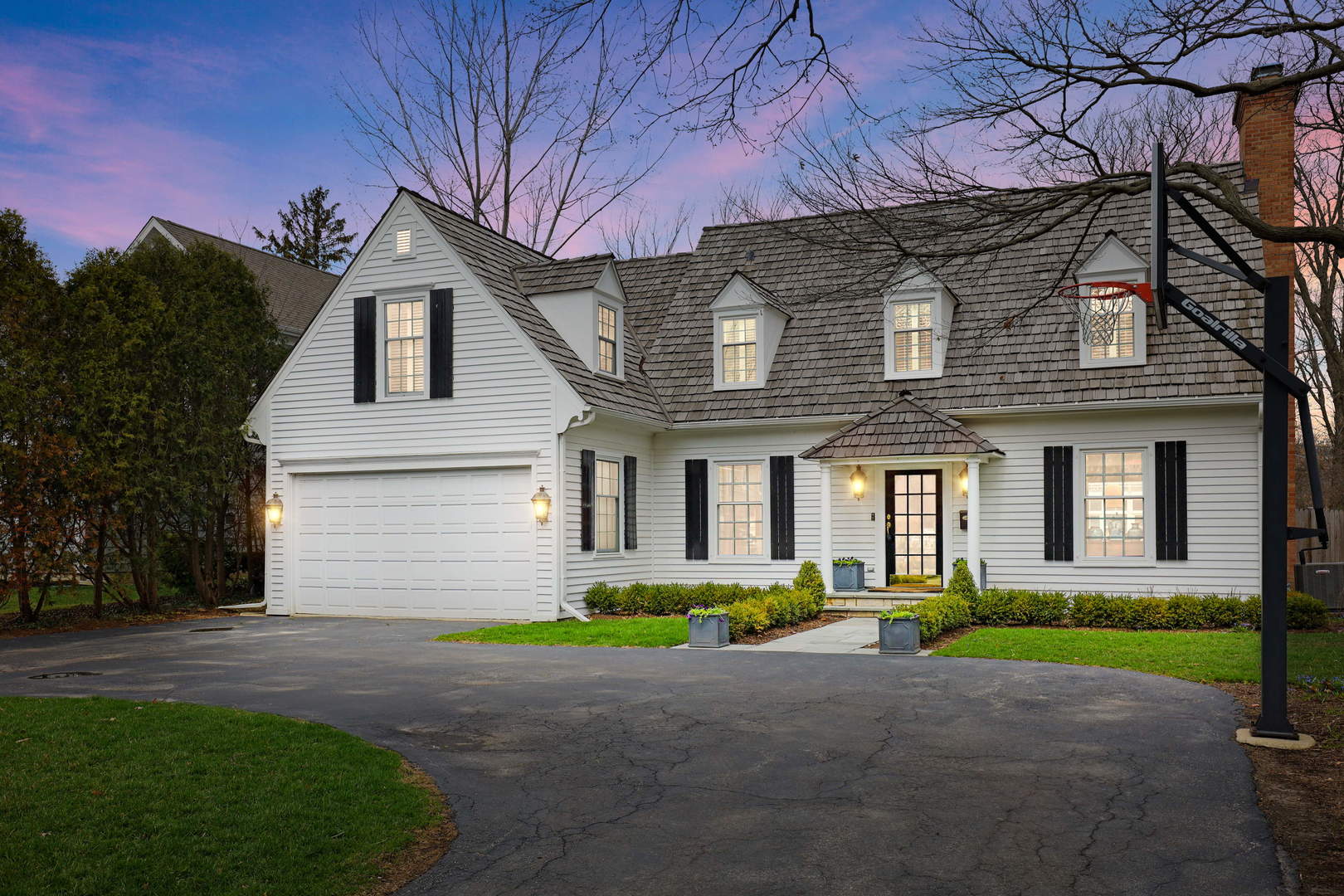 138 East Sheridan Road Lake Bluff, IL 60044 - Photo 39 of 39 a front view of a house with a garden and garage
