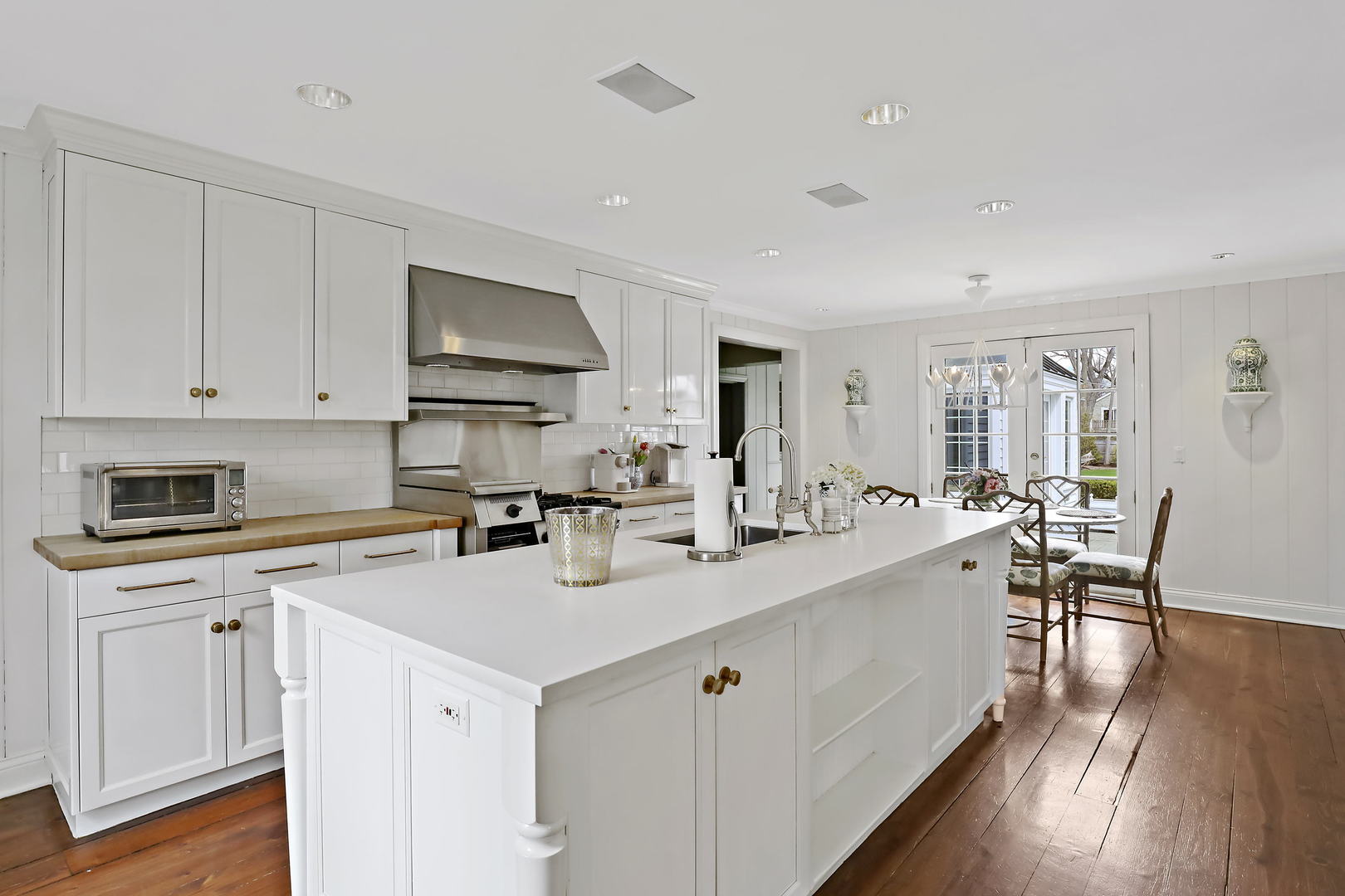 138 East Sheridan Road Lake Bluff, IL 60044 - Photo 8 of 39 a kitchen with a sink cabinets and wooden floor