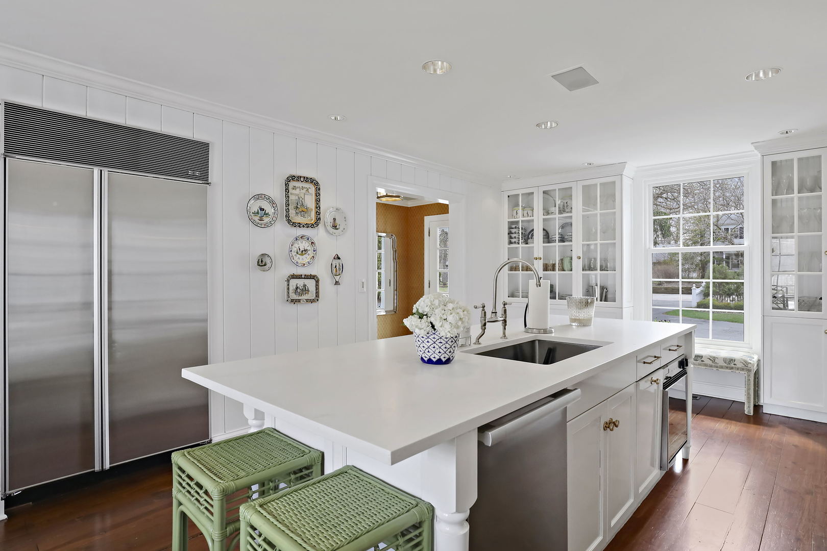 138 East Sheridan Road Lake Bluff, IL 60044 - Photo 10 of 39 a kitchen with a sink and chairs