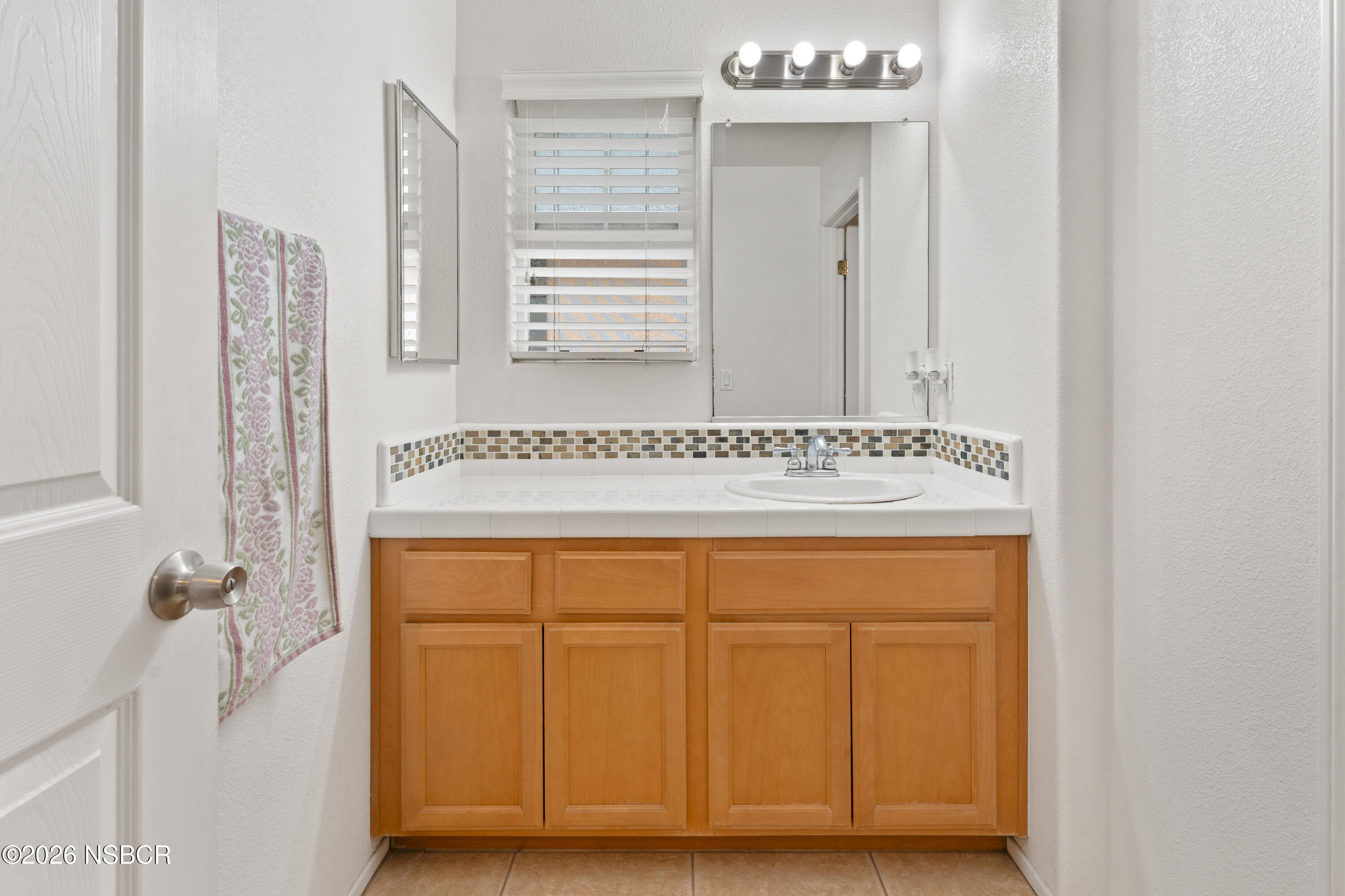 240 Quail Circle Lompoc, CA 93436 - Photo 16 of 19 a view of a bathroom with mirror