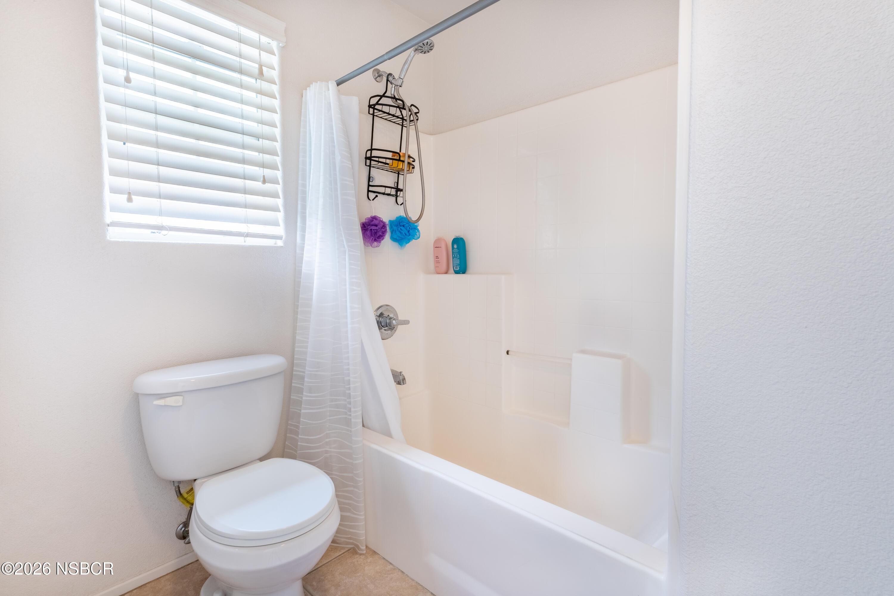 240 Quail Circle Lompoc, CA 93436 - Photo 17 of 19 a white toilet sitting next to a bath tub
