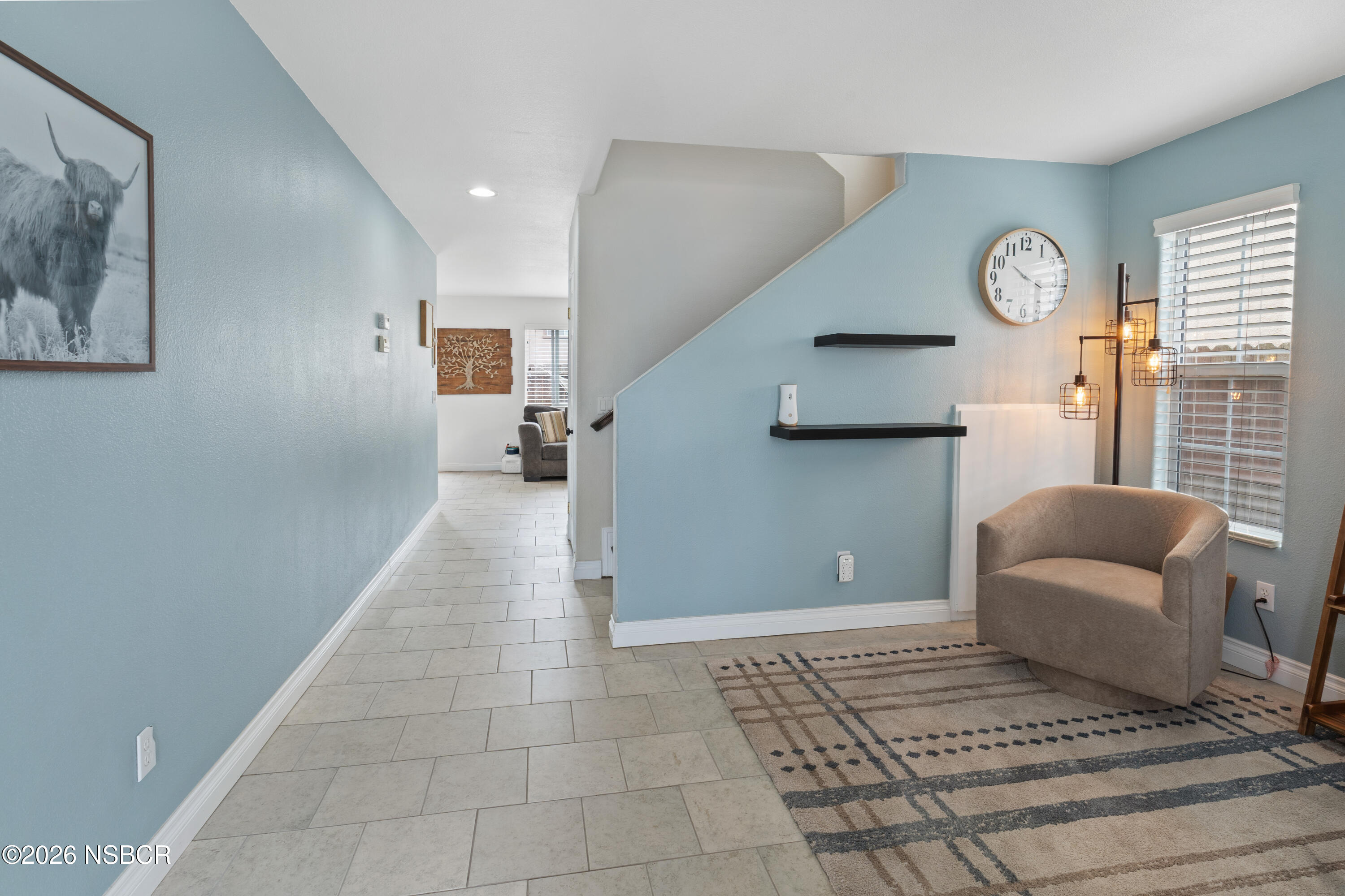 240 Quail Circle Lompoc, CA 93436 - Photo 2 of 19 a living room with furniture and a clock