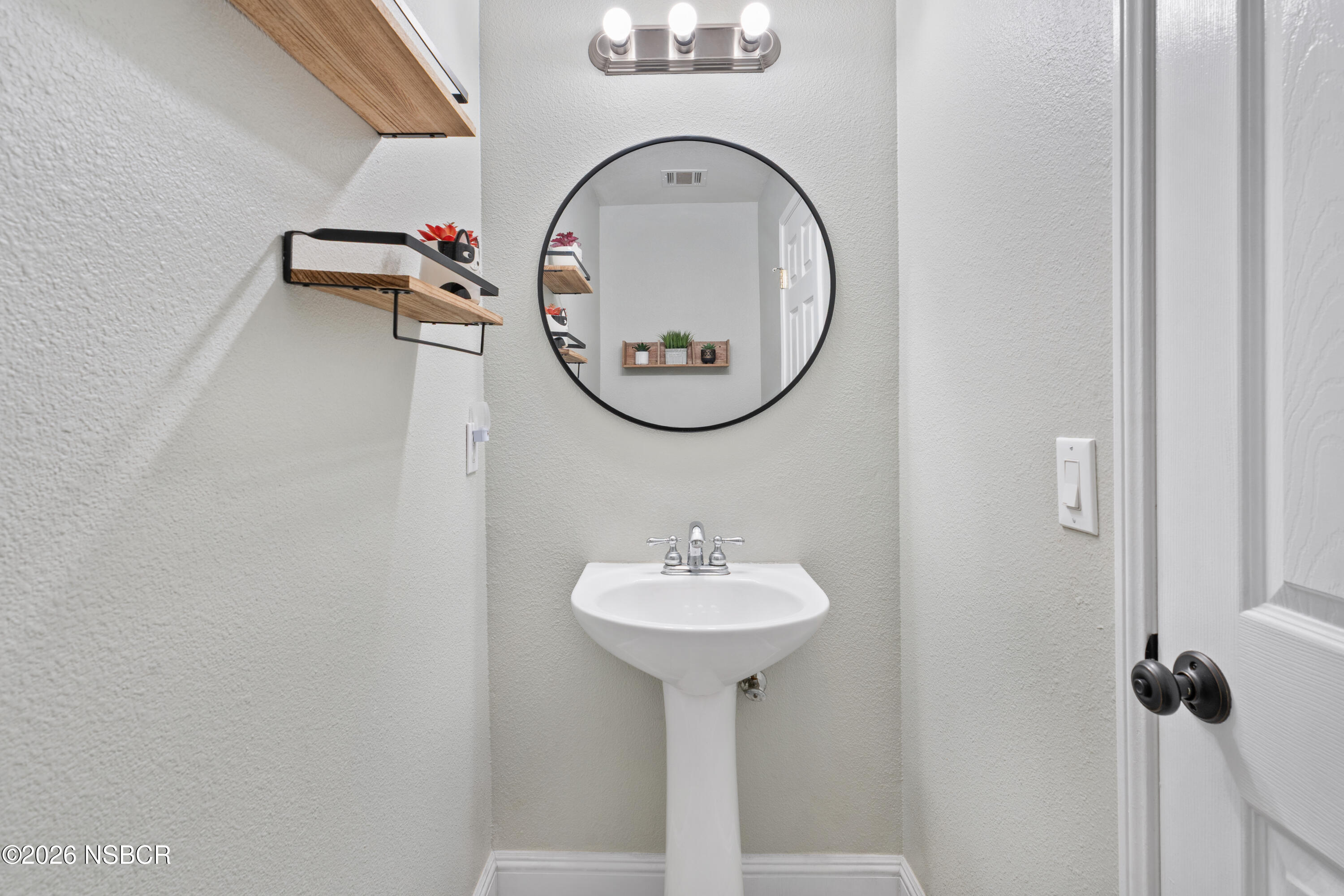 240 Quail Circle Lompoc, CA 93436 - Photo 7 of 19 a bathroom with a sink and a mirror
