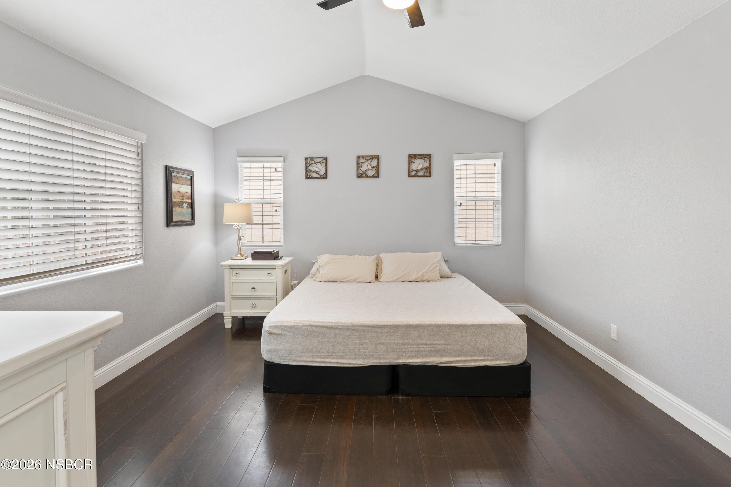 240 Quail Circle Lompoc, CA 93436 - Photo 8 of 19 a bedroom with a bed and wooden floor