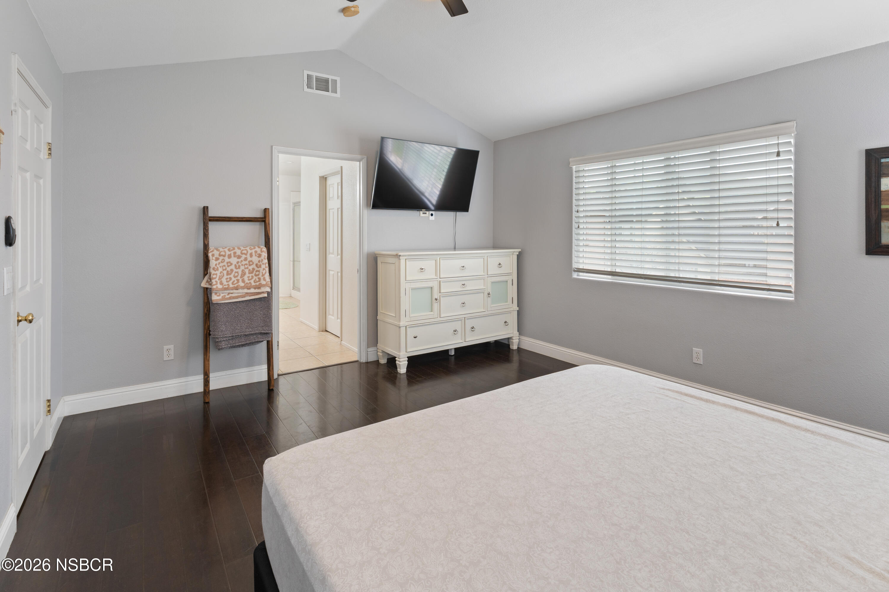 240 Quail Circle Lompoc, CA 93436 - Photo 9 of 19 a bedroom with a bed and wooden floor