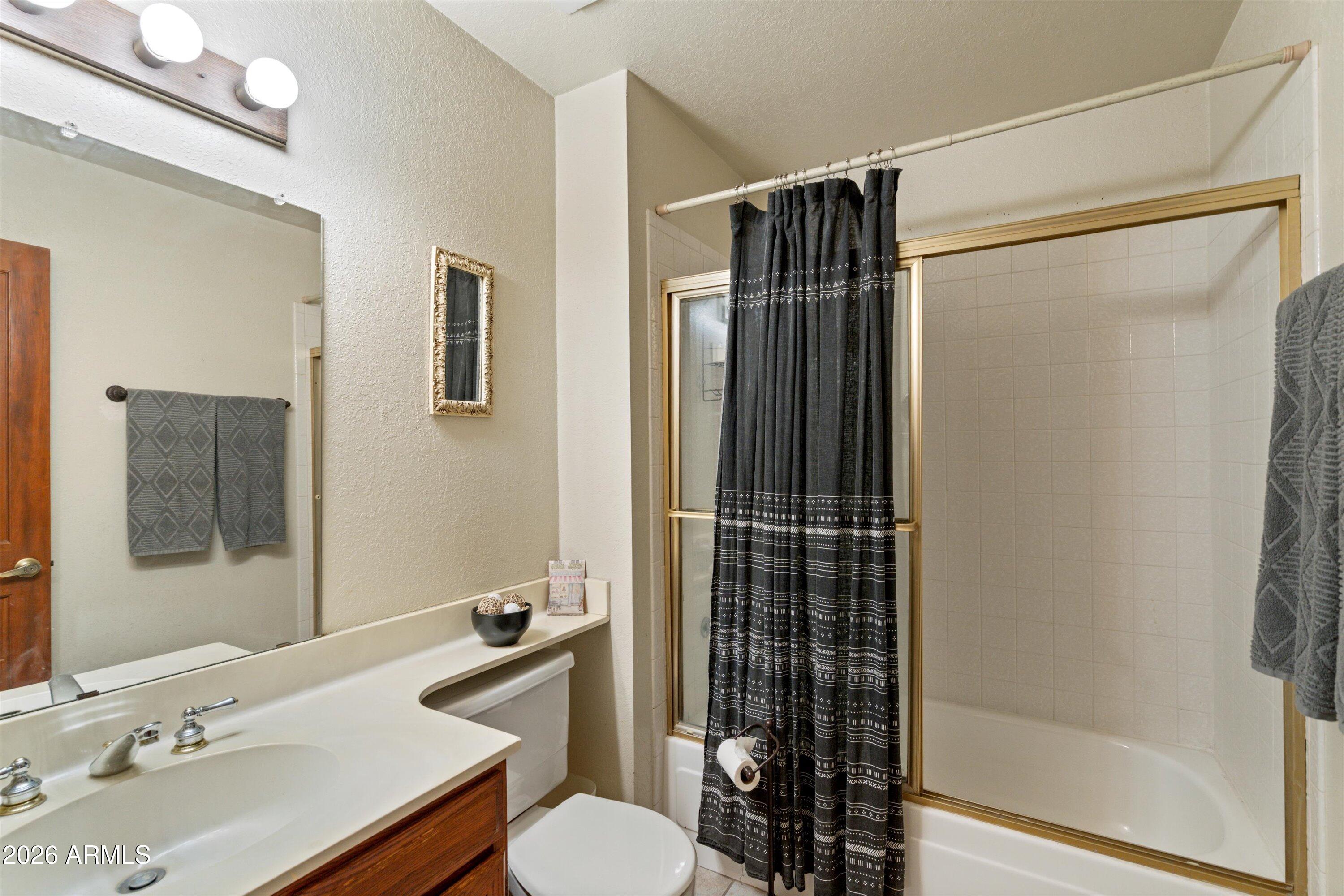1301 West Rio Salado Parkway, Unit 22 Mesa, AZ 85201 - Photo 16 of 21 a bathroom with a sink toilet and shower