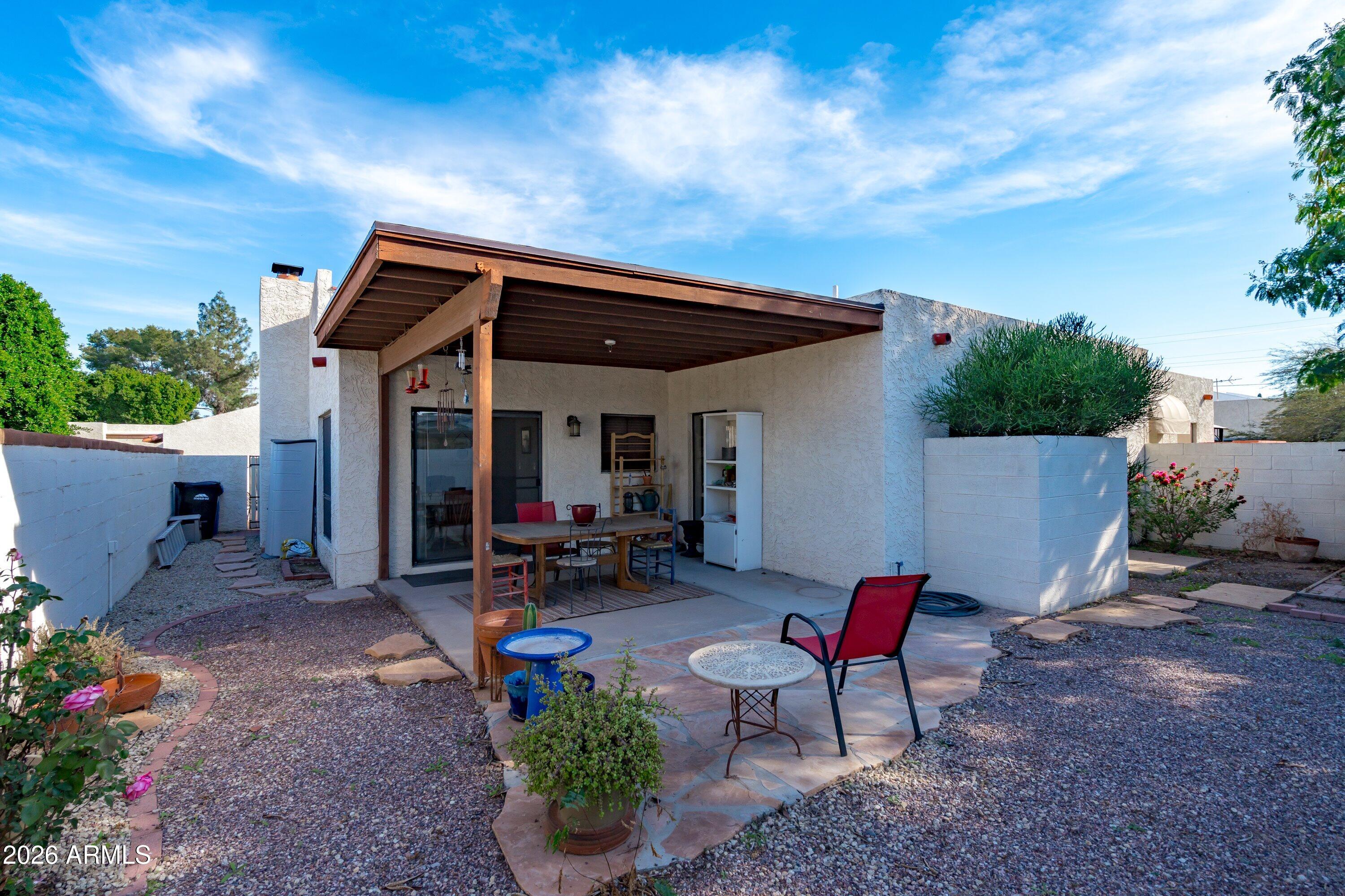 1301 West Rio Salado Parkway, Unit 22 Mesa, AZ 85201 - Photo 18 of 21 a view of a house with backyard and sitting area