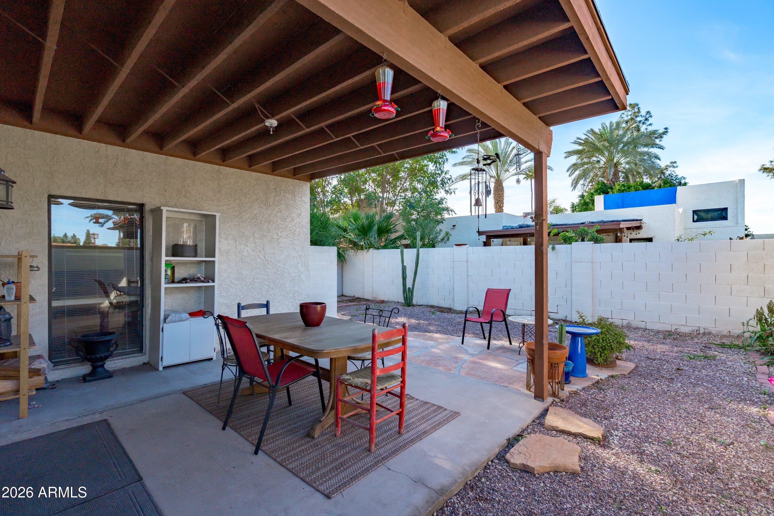 1301 West Rio Salado Parkway, Unit 22 Mesa, AZ 85201 - Photo 19 of 21 a view of a table and chairs in patio