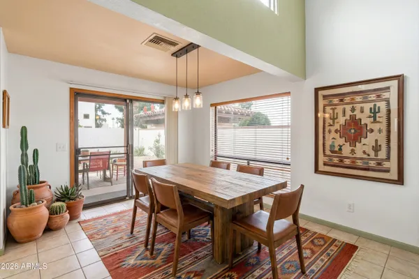 a view of a dining room with furniture window and outside view