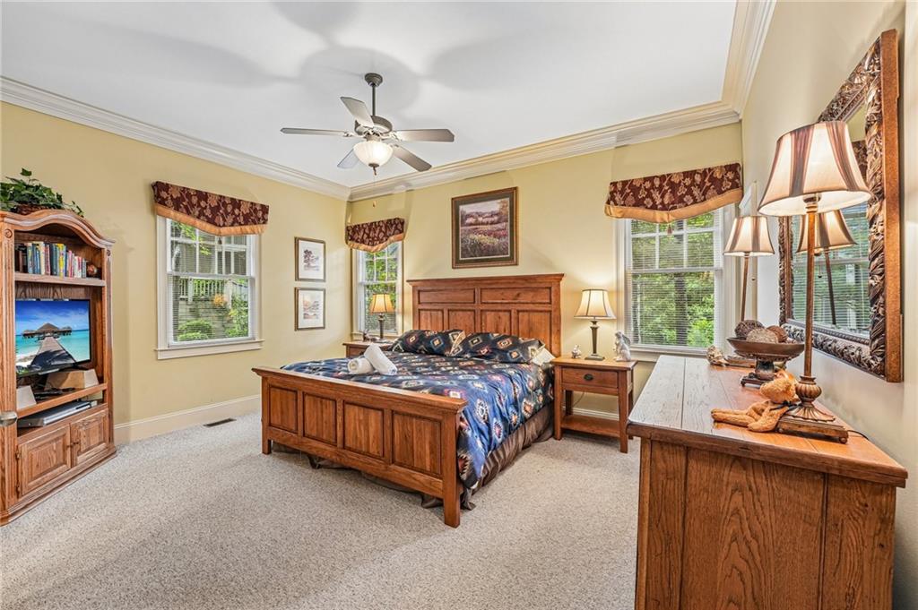 14 Laurel Ridge Lane Big Canoe, GA 30143 - Photo 24 of 72 a spacious bedroom with a bed and a large window