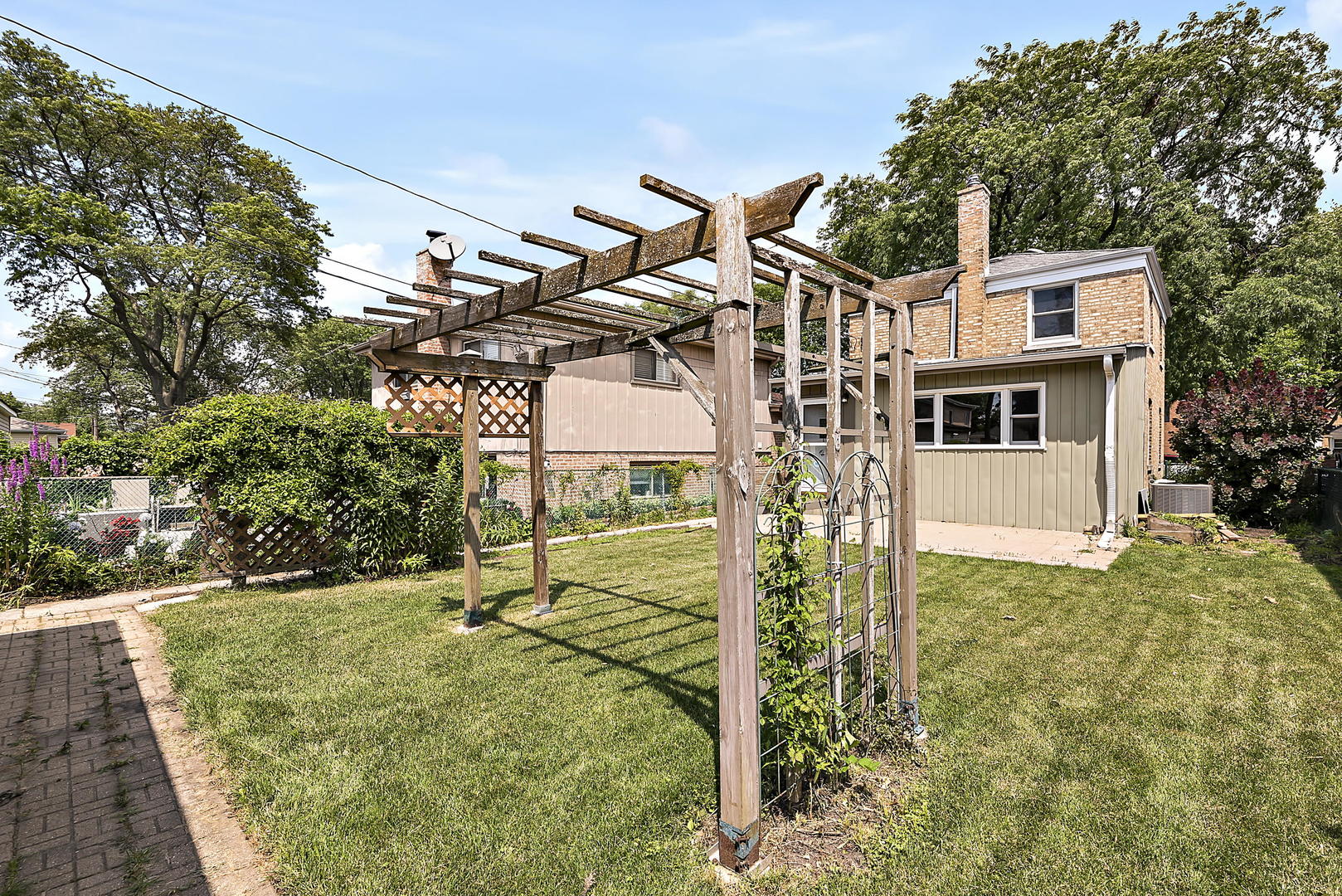 7438 Kenneth Avenue Skokie, IL 60076 - Photo 15 of 17 a view of outdoor space and yard