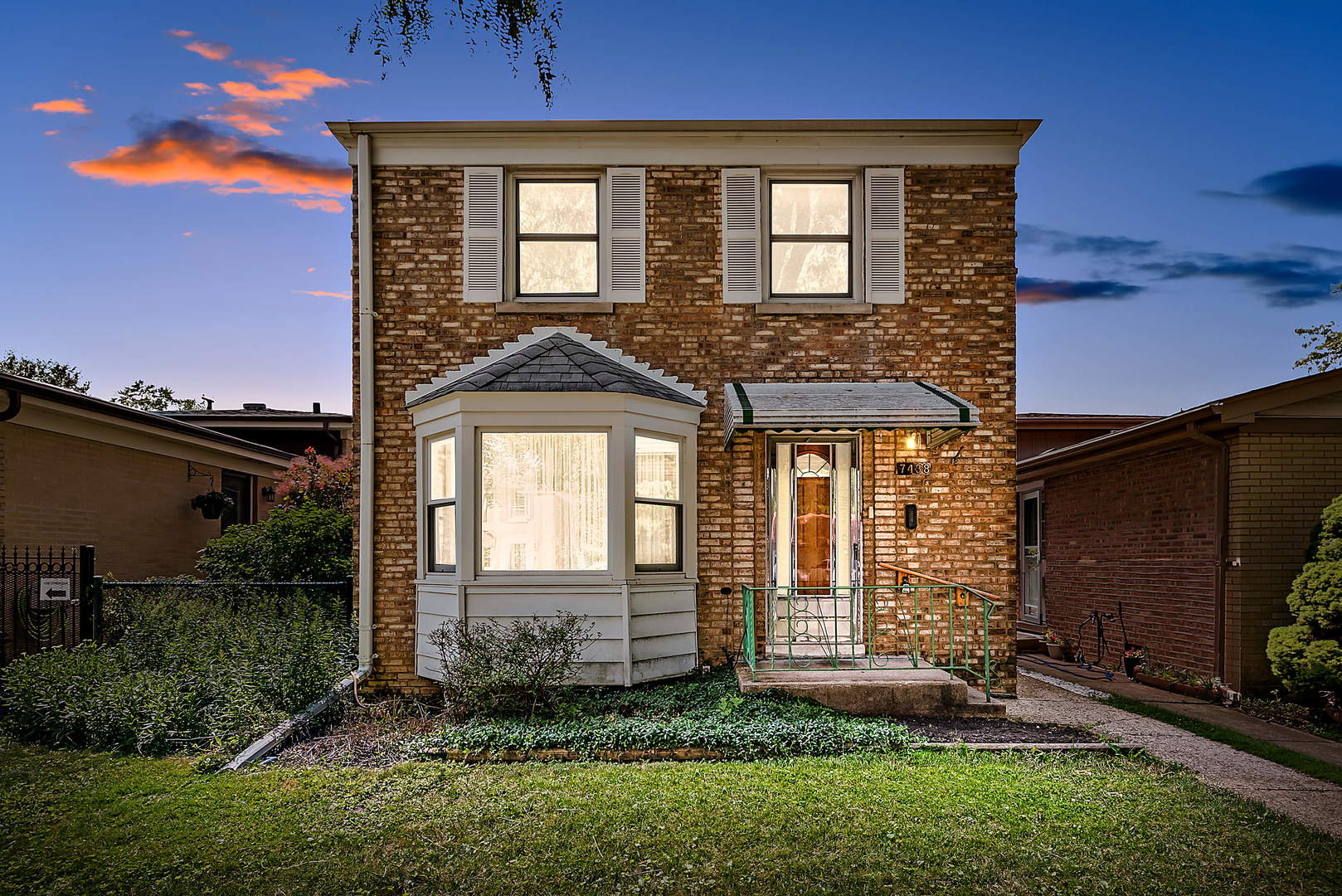 7438 Kenneth Avenue Skokie, IL 60076 - Photo 16 of 17 a front view of a house with garden