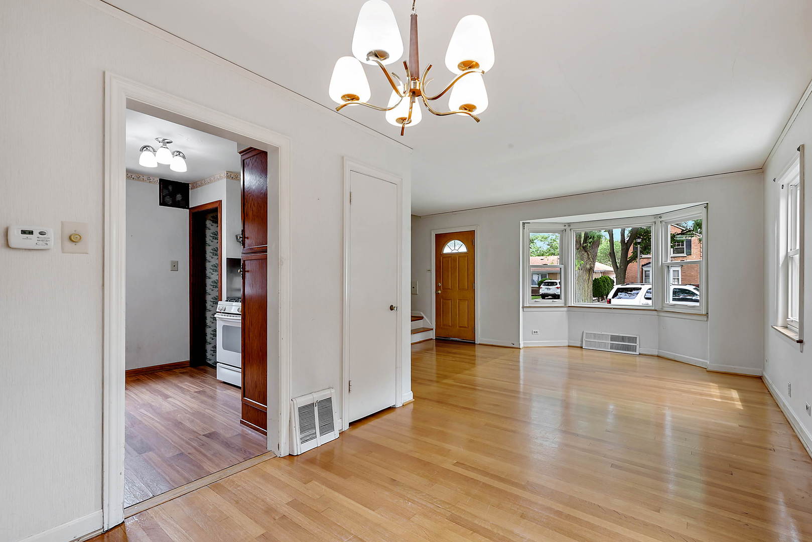7438 Kenneth Avenue Skokie, IL 60076 - Photo 4 of 17 a view interior of the house and livingroom with wooden floor