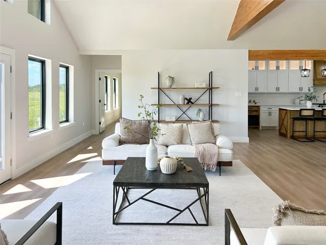 a living room with furniture and a table