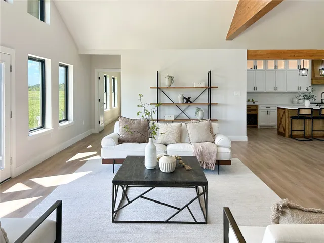 a living room with furniture and a table