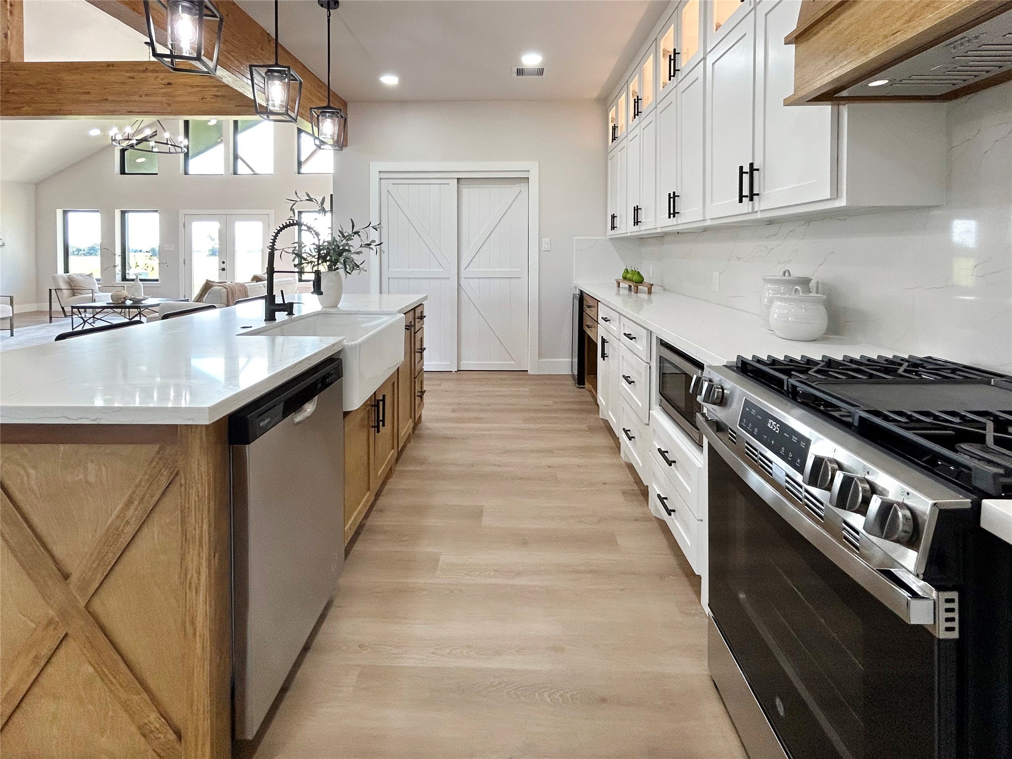 619 Chuckwagon Trail Angleton, TX 77515 - Photo 18 of 35 a kitchen with stainless steel appliances granite countertop a sink stove and cabinets
