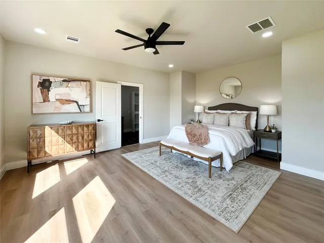 a bedroom with a bed and a rug