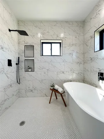 a bathroom with a bathtub and a sink