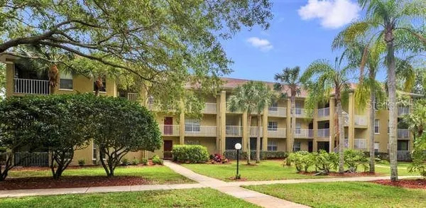 a view of a building with a yard