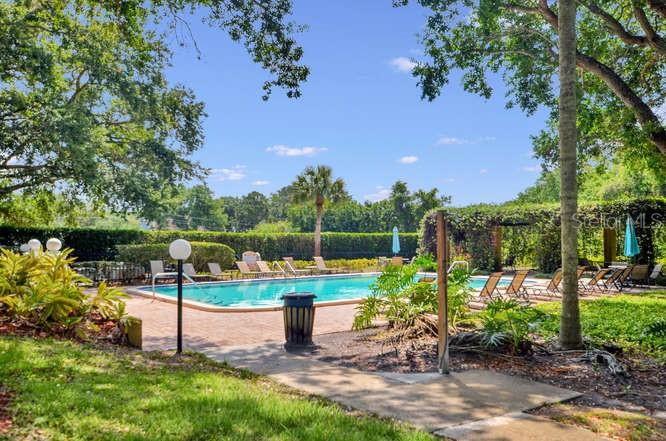 2690 Coral Landings Boulevard, Unit 622 Palm Harbor, FL 34684 - Photo 23 of 31 a view of a garden with sitting area