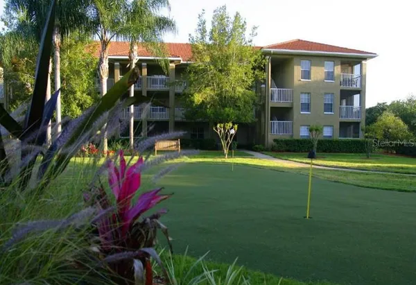 an aerial view of residential house with outdoor space and swimming pool