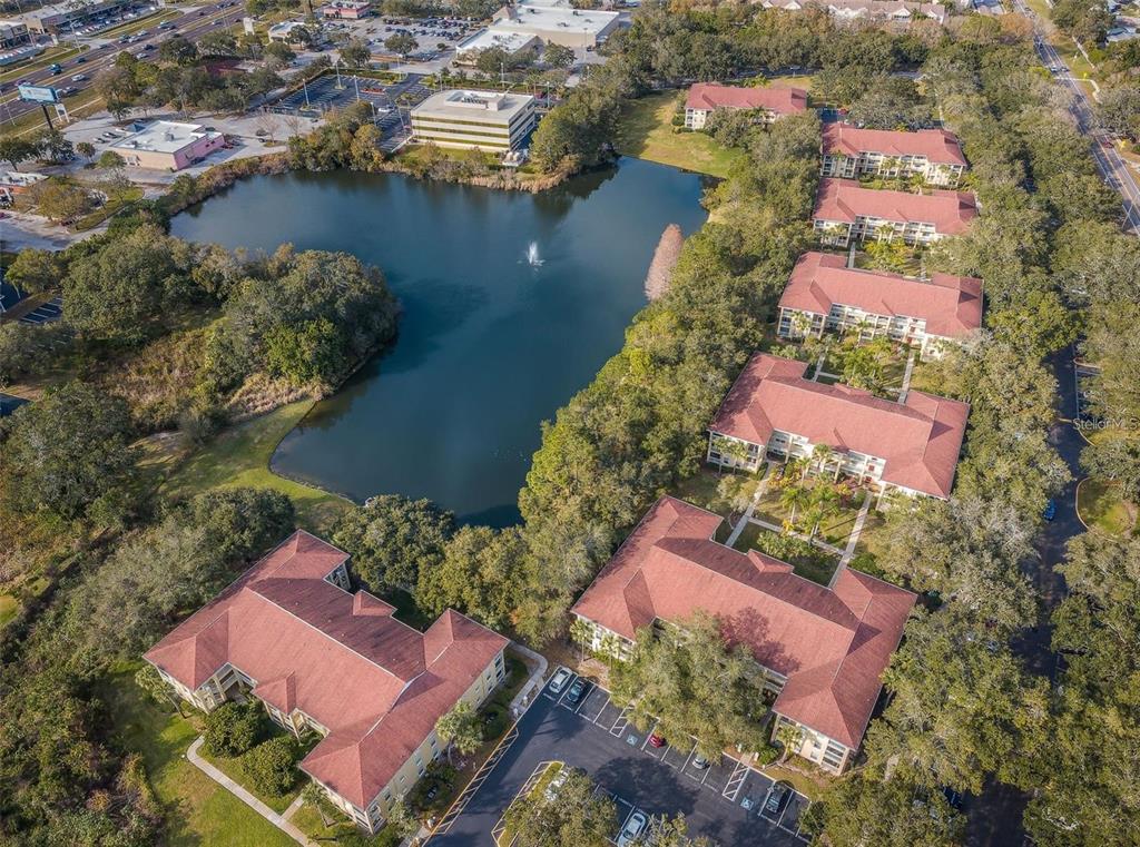 2690 Coral Landings Boulevard, Unit 622 Palm Harbor, FL 34684 - Photo 28 of 31 an aerial view of residential house with outdoor space and swimming pool