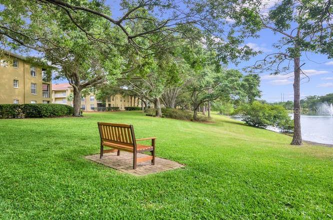2690 Coral Landings Boulevard, Unit 622 Palm Harbor, FL 34684 - Photo 30 of 31 a garden view with a seating space