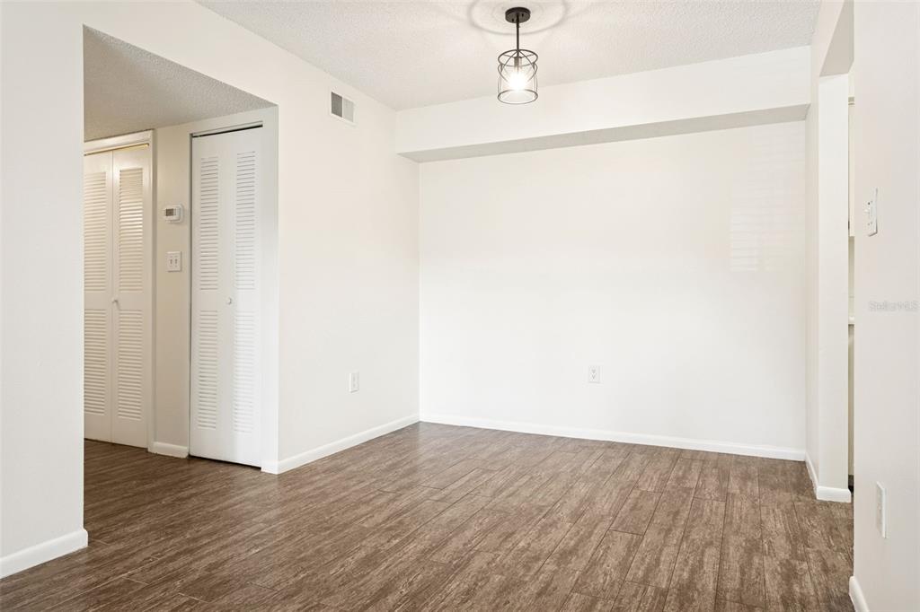 2690 Coral Landings Boulevard, Unit 622 Palm Harbor, FL 34684 - Photo 5 of 31 a view of an empty room with wooden floor