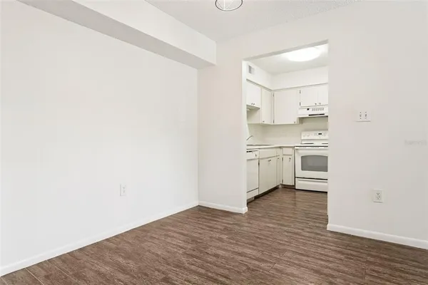 a view of kitchen with wooden floor