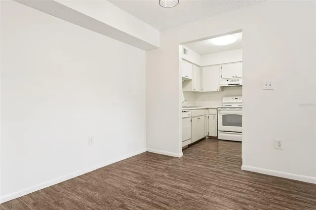 a view of kitchen with wooden floor