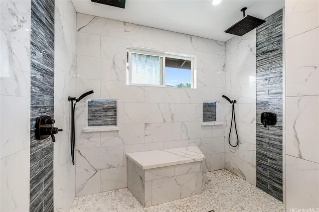 a bathroom with a toilet and shower