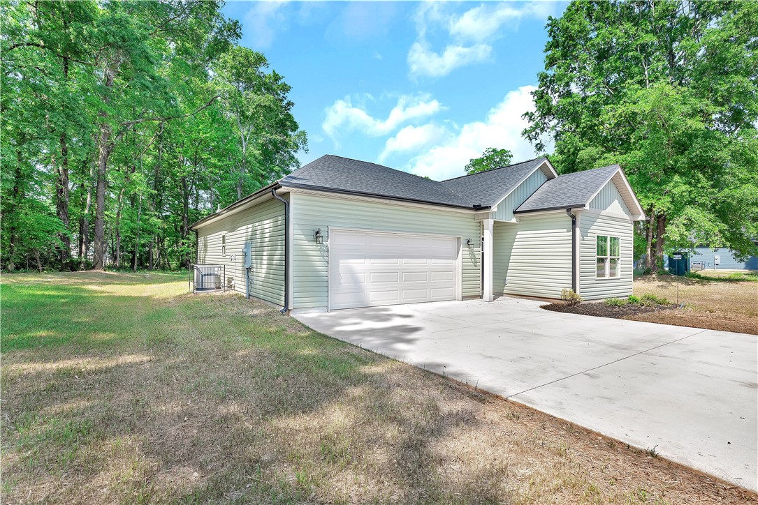 112 Brookridge Drive Anderson, SC 29624 - Photo 25 of 27 This newly constructed home features a spacious garage and ample green space, perfect for outdoor enjoyment.